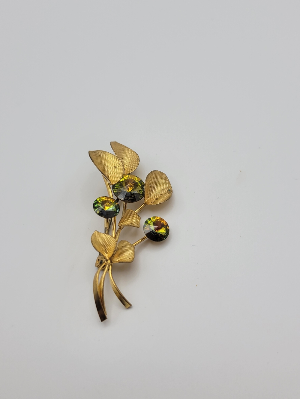 Vintage gold tone made in Austria Green Aurora Crystals leaf brooch